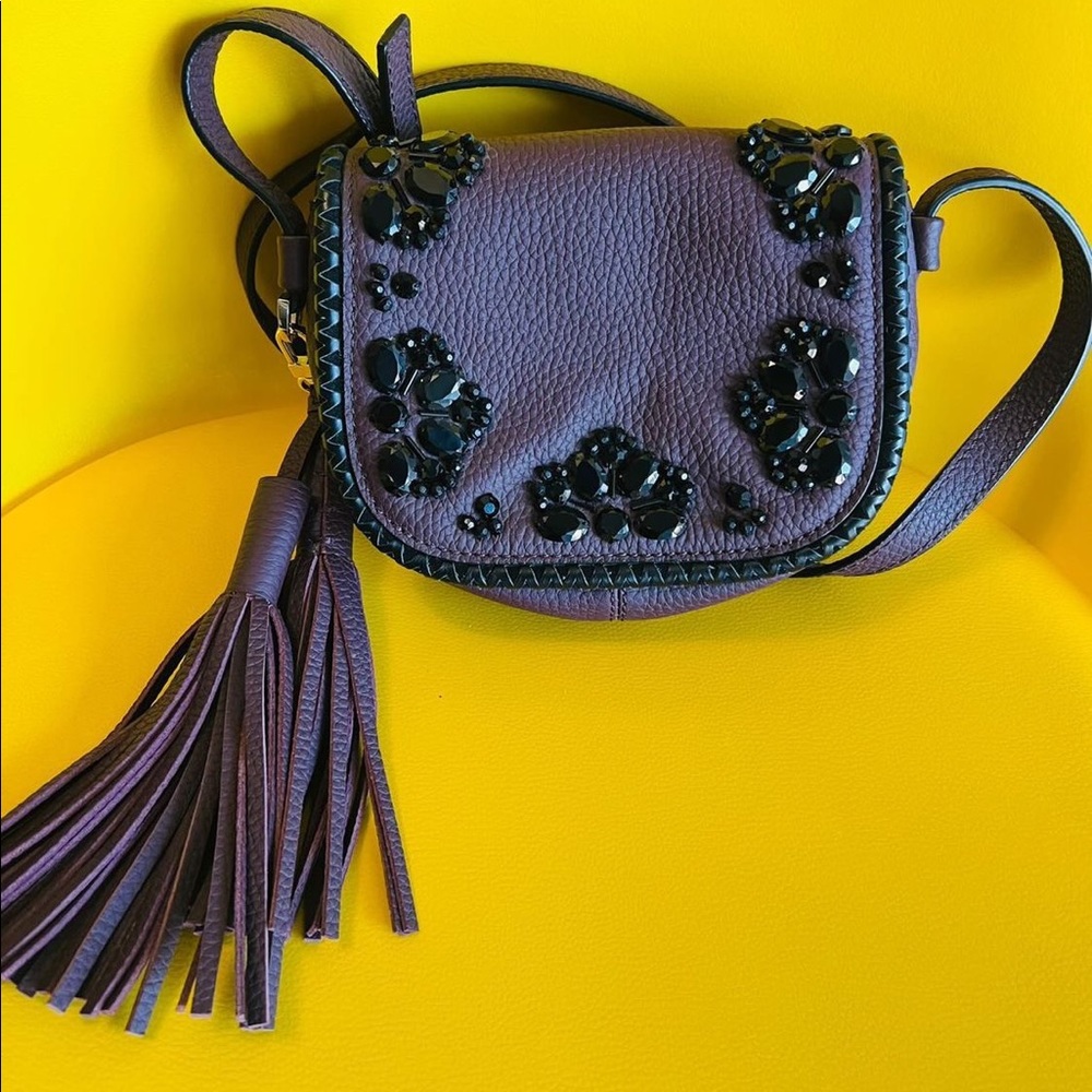 Kate Spade Burgundy crossbody purse with Black Jewels and Tassel.